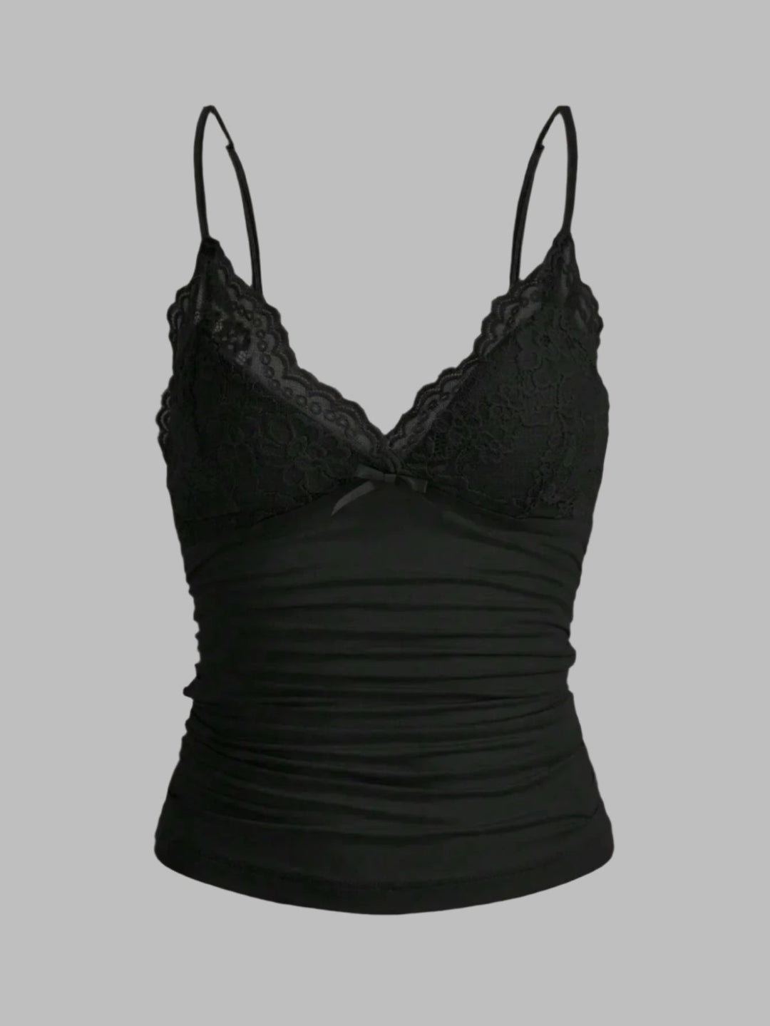 Dame kort top med blondekant og sløjfe. Let, justerbare stropper, perfekt til sommerlook.