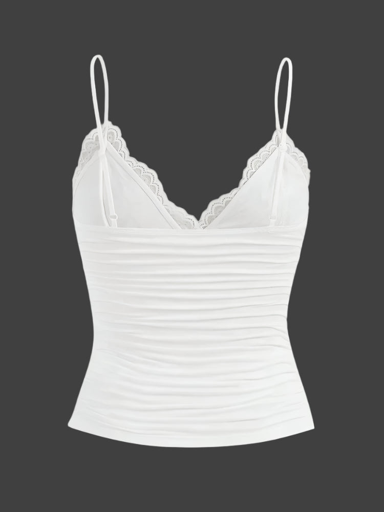 Dame kort top med blondekant og sløjfe. Let, justerbare stropper, perfekt til sommerlook.