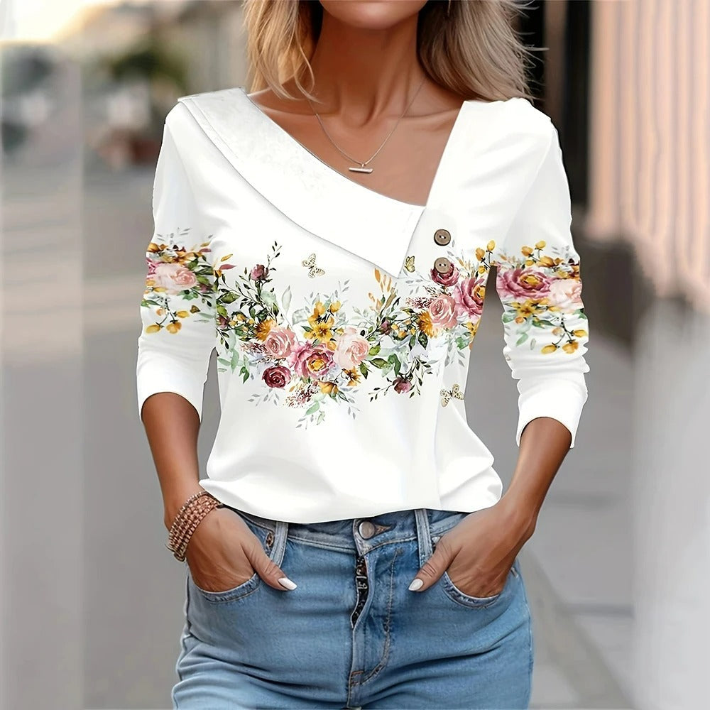 Damebluse med blomstertryk, lange ærmer, elegant og komfortabel, åndbart materiale, fuld af farver.