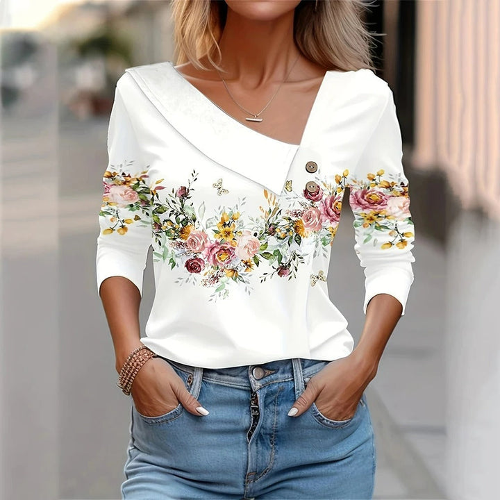 Damebluse med blomstertryk, lange ærmer, elegant og komfortabel, åndbart materiale, fuld af farver.