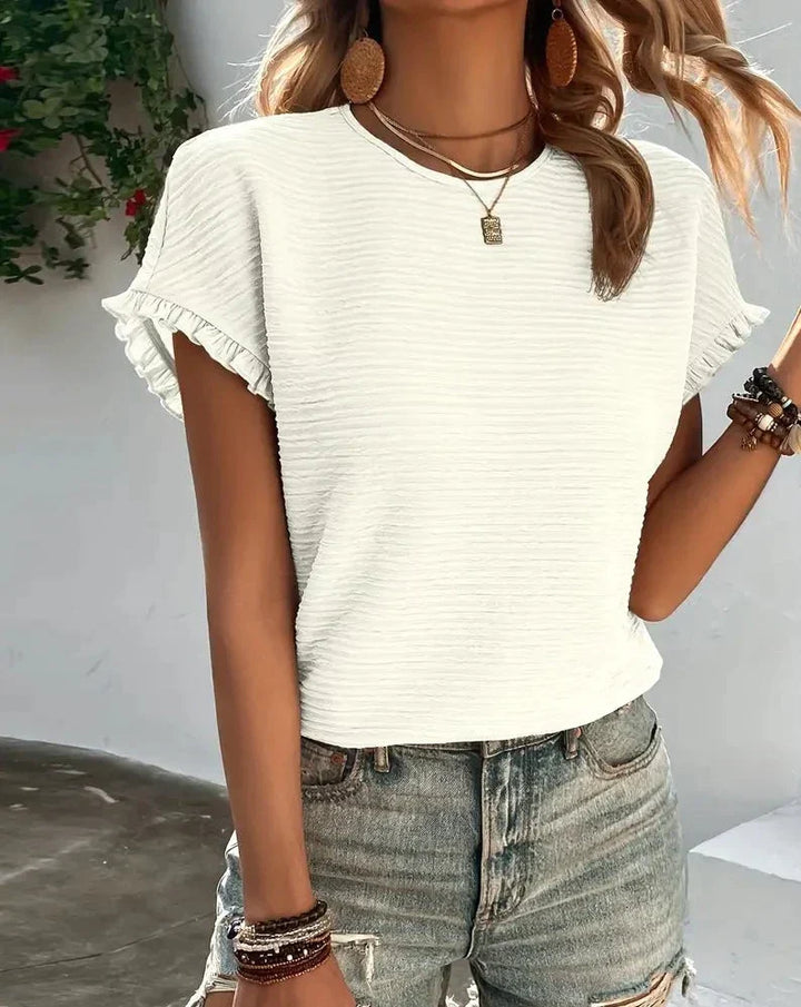 Dame T-shirt, afslappet sommerstil, i et behageligt materiale, tilgængelig i flere farver, komfortabel og nem at style.