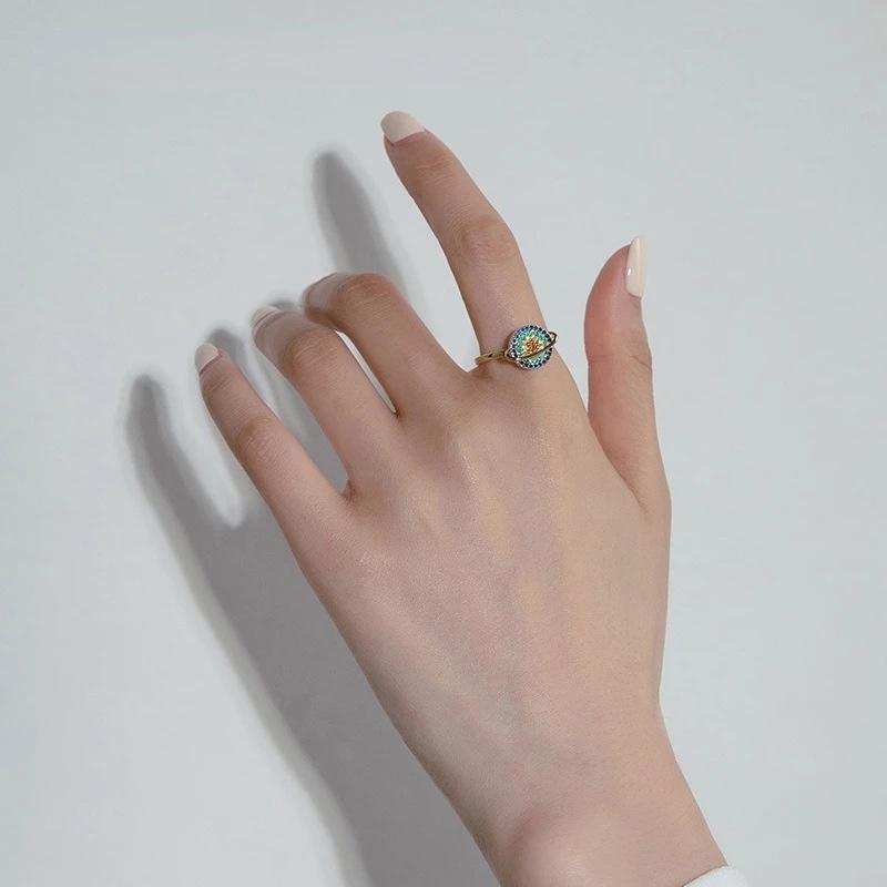 Dame roterende galakse ring, metallegering, sølvfarvet, lindrer angst og fremmer mental beroligelse.