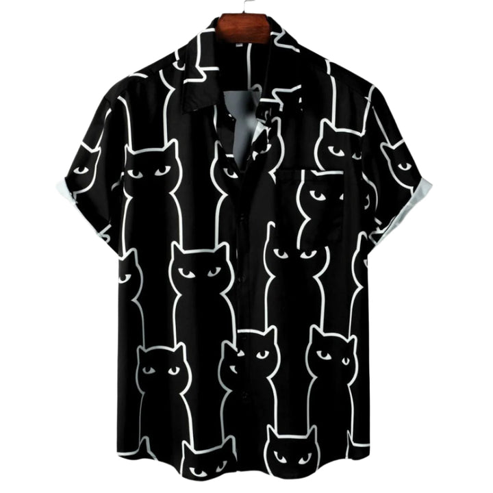Dame afslappet sort t-shirt med katteprint, let og åndbart stof, farverigt katteprint foran, stilfuldt look.