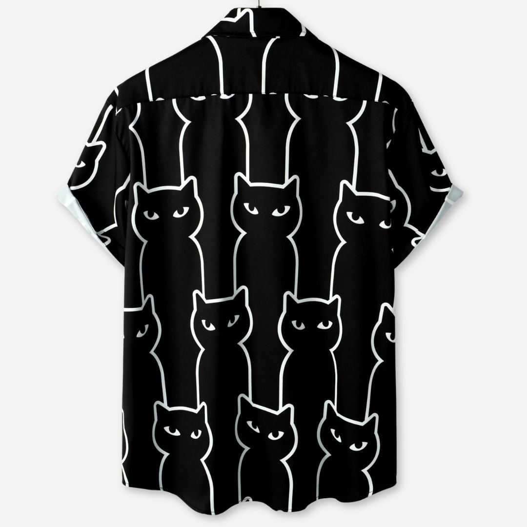 Dame afslappet sort t-shirt med katteprint, let og åndbart stof, farverigt katteprint foran, stilfuldt look.