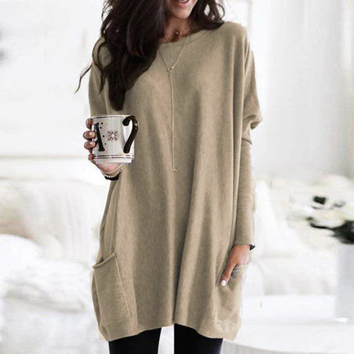 Dame afslappet langærmet pullover, blødt stof, forlommer, stilfuldt look, fotograferet forfra, velegnet til hverdag og fritid.