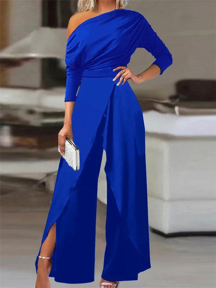 Dame jumpsuit med rynker, vide ben og cold shoulder i blå, elegant og moderne til forår/sommer.