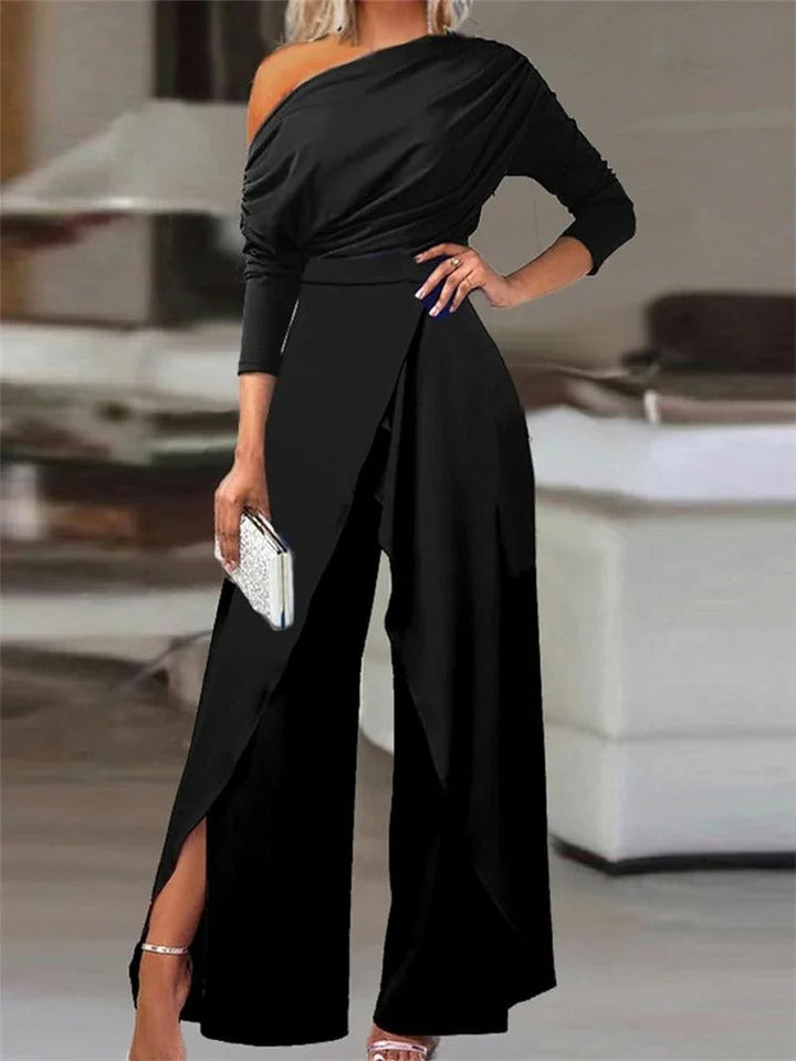 Dame jumpsuit med rynker, vide ben og cold shoulder i blå, elegant og moderne til forår/sommer.