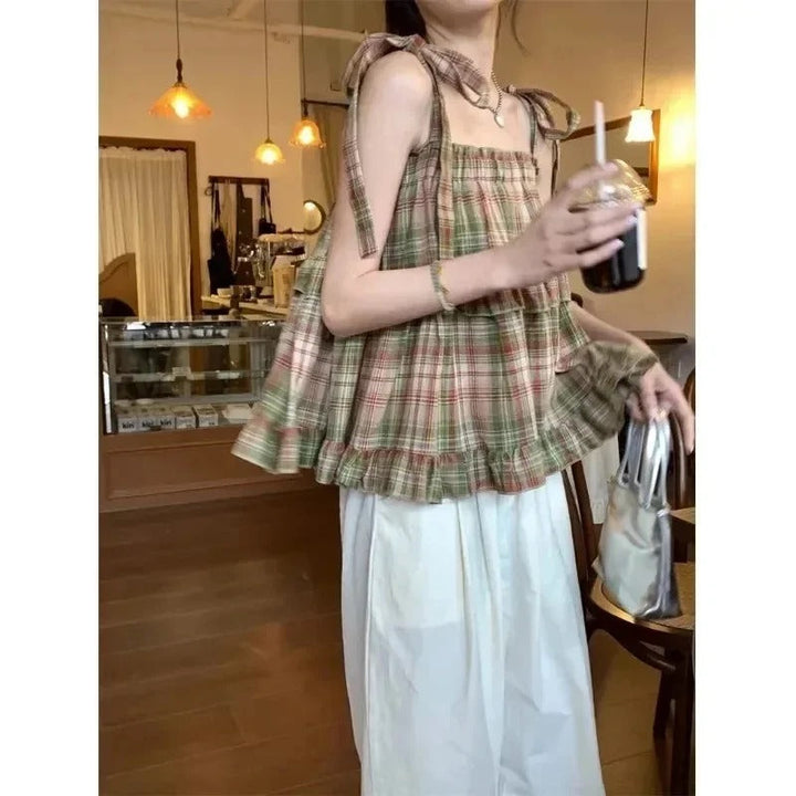 Dame tjekket frakke med snøre, Y2K, ærmeløs, justerbare skulderstropper, vintage-stil, streetwear-look.