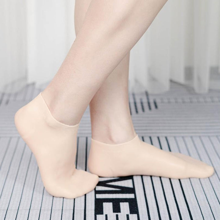 Kvinde silikonesokker med fugtgivende gel, lyserød, blød og fleksibel til spa-pedicure til hjemmebrug.