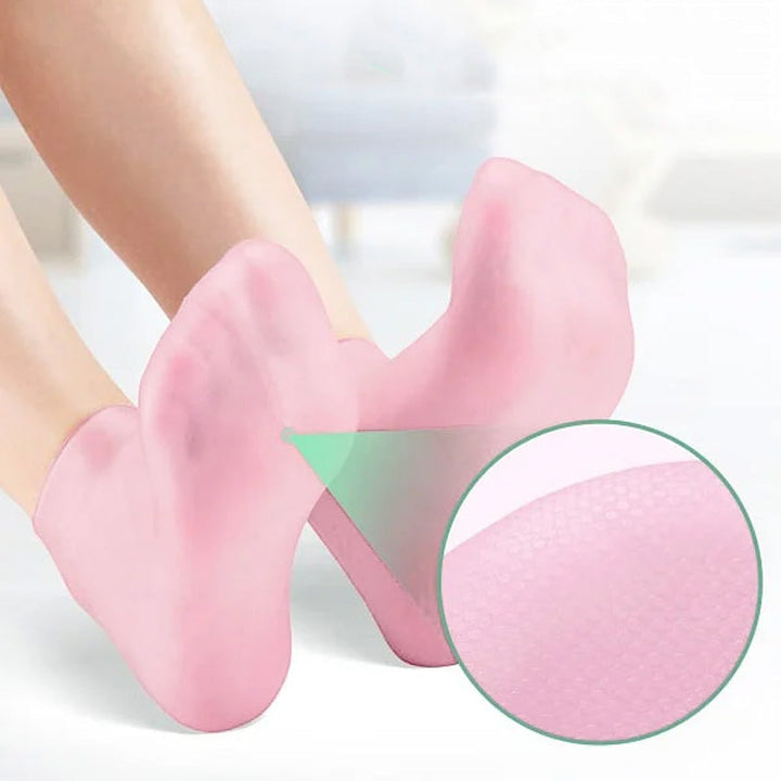 Kvinde silikonesokker med fugtgivende gel, lyserød, blød og fleksibel til spa-pedicure til hjemmebrug.