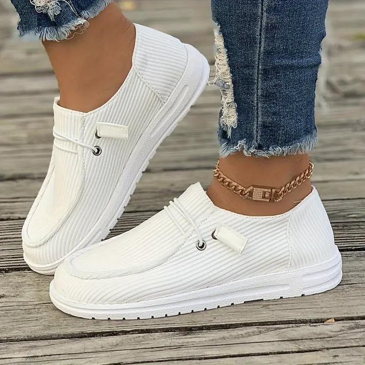 Dame slip-on fritidssko, behagelig pasform, tidløst design, holdbart materiale, nem at bruge og stilfuld.