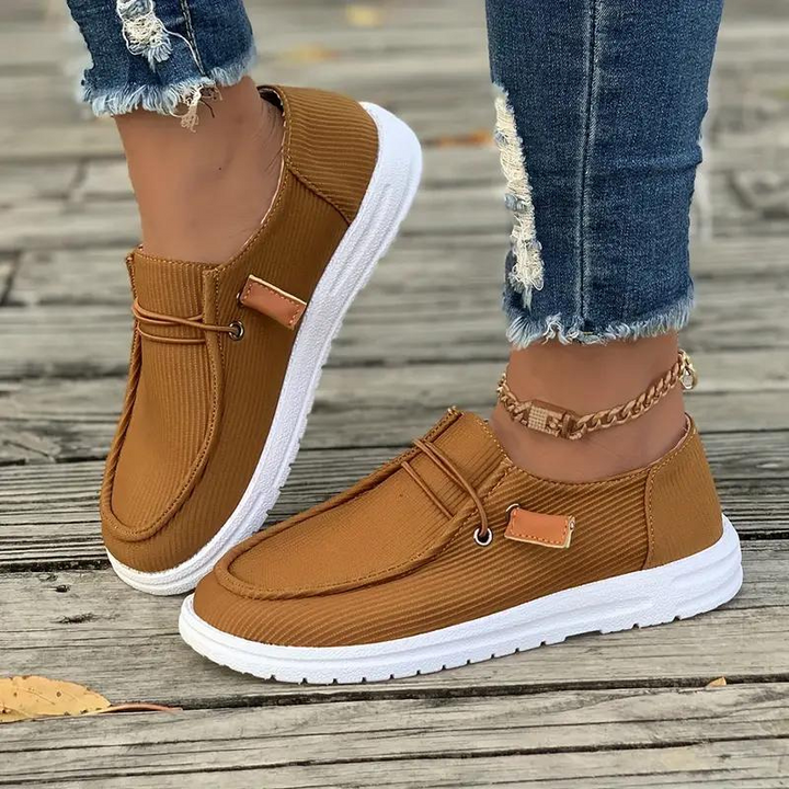 Dame slip-on fritidssko, behagelig pasform, tidløst design, holdbart materiale, nem at bruge og stilfuld.