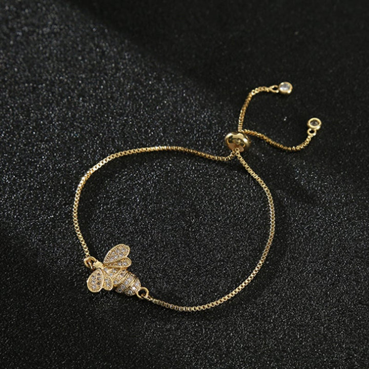 Dame sterling sølv bi armbånd med zirkon, elegant design, reflekterer sollys, justerbar stil.