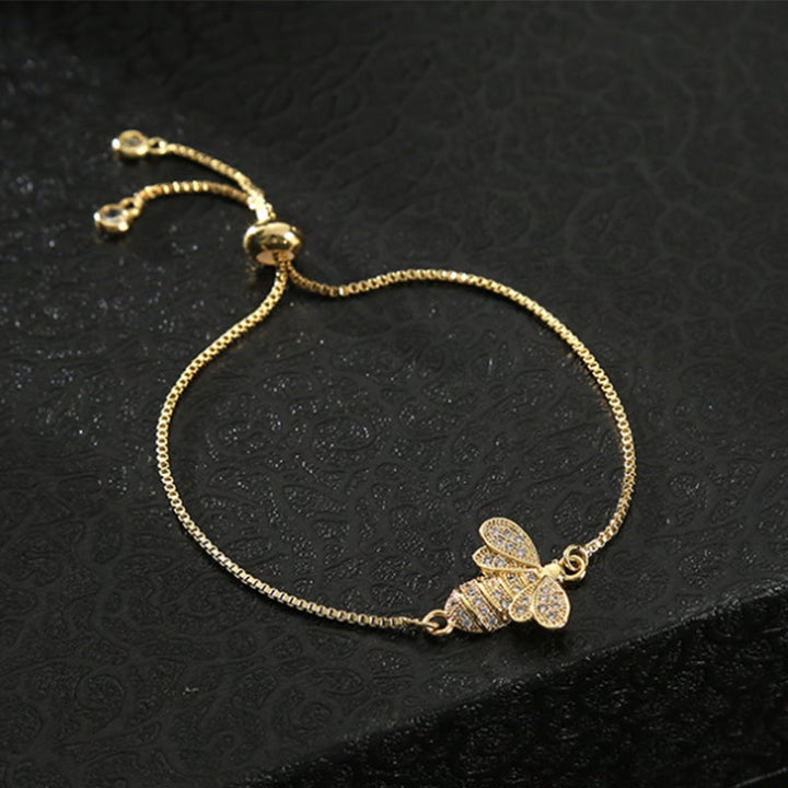 Dame sterling sølv bi armbånd med zirkon, elegant design, reflekterer sollys, justerbar stil.