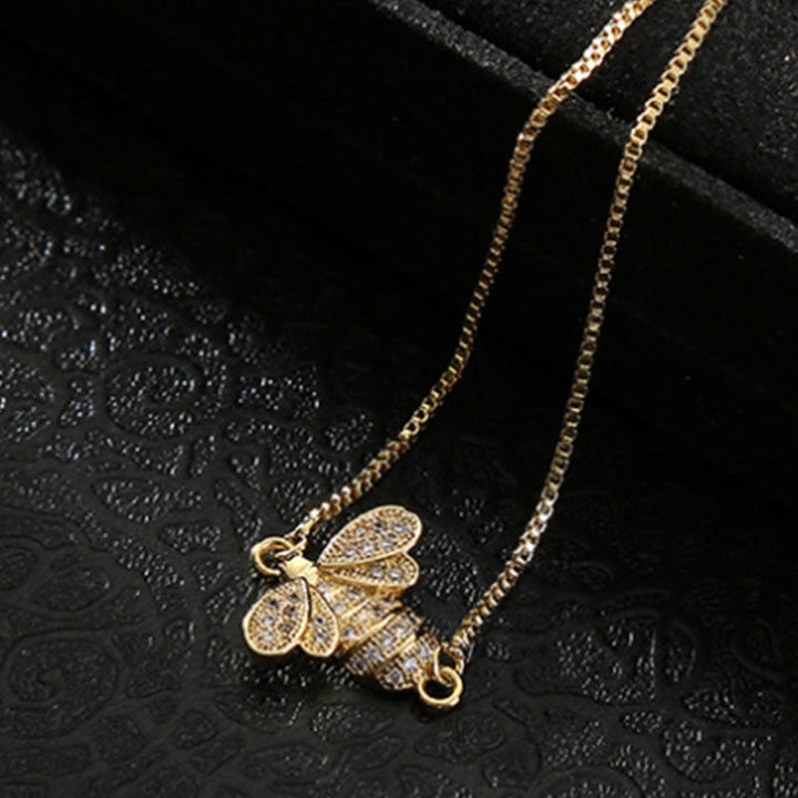 Dame sterling sølv bi armbånd med zirkon, elegant design, reflekterer sollys, justerbar stil.