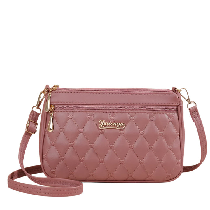 Dame elegant broderet crossbody taske, kompakt størrelse, subtil broderi, justerbar skulderrem.
