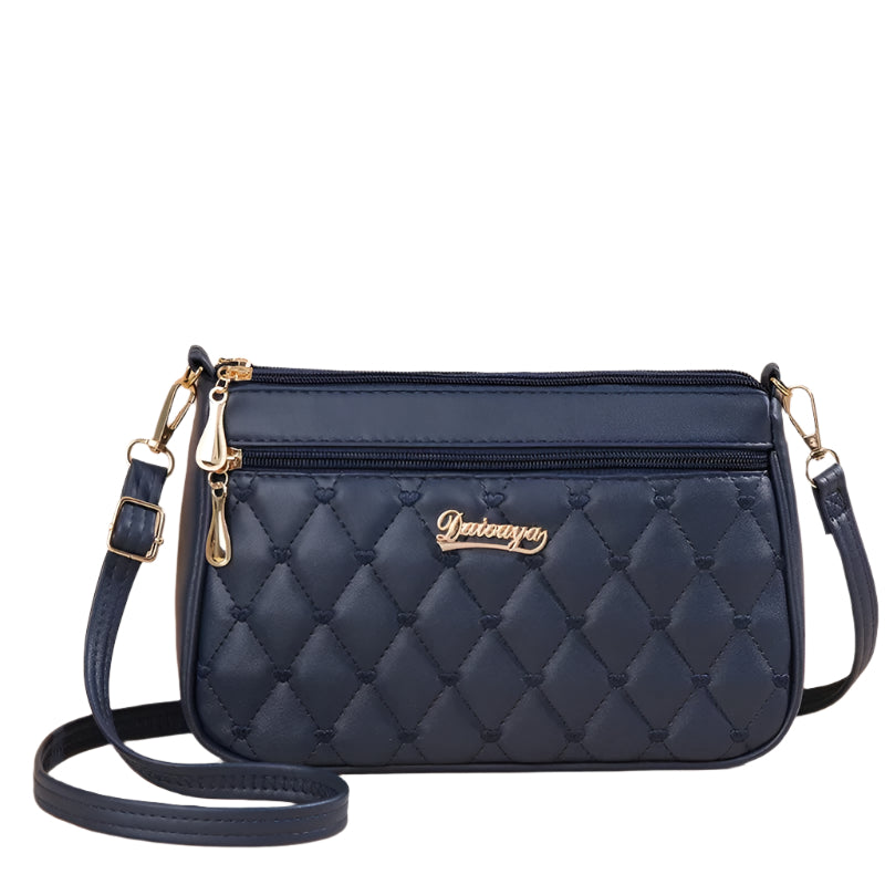Dame elegant broderet crossbody taske, kompakt størrelse, subtil broderi, justerbar skulderrem.