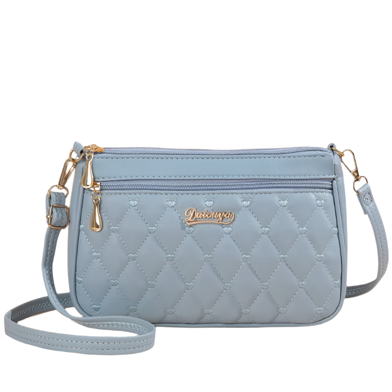 Dame elegant broderet crossbody taske, kompakt størrelse, subtil broderi, justerbar skulderrem.