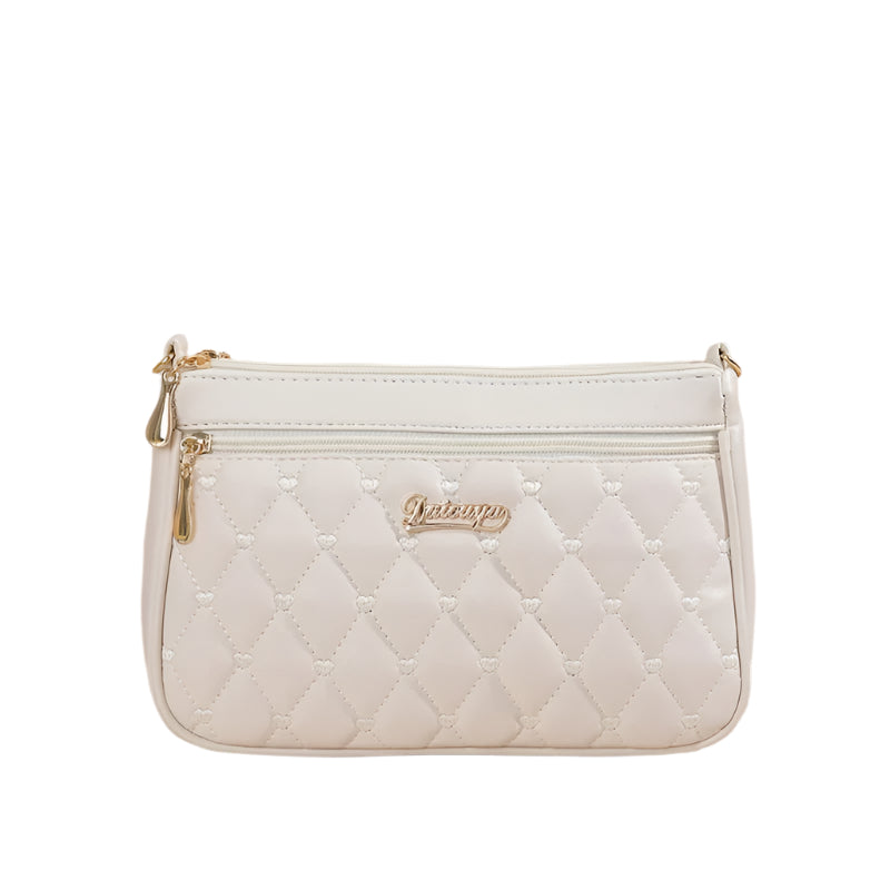 Dame elegant broderet crossbody taske, kompakt størrelse, subtil broderi, justerbar skulderrem.