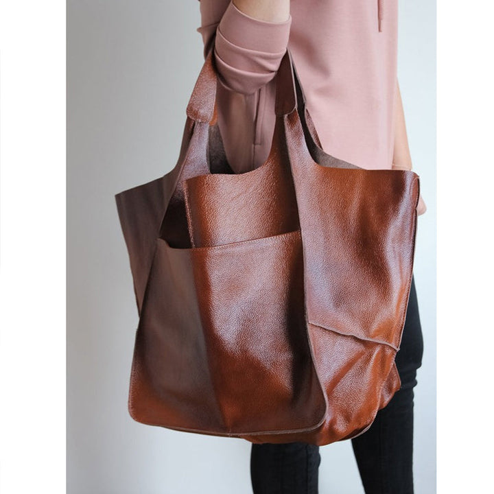Dame elegant oversize skuldertaske i sort kunstlæder, passer til fest eller hverdag. Elegant tilbehør til damemode.