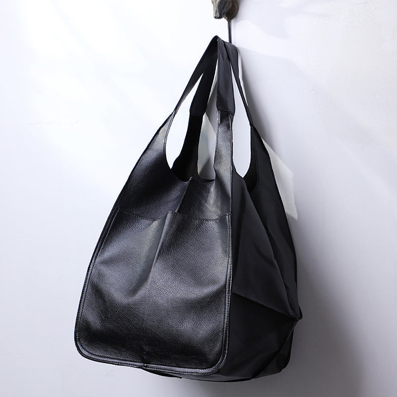 Dame elegant oversize skuldertaske i sort kunstlæder, passer til fest eller hverdag. Elegant tilbehør til damemode.