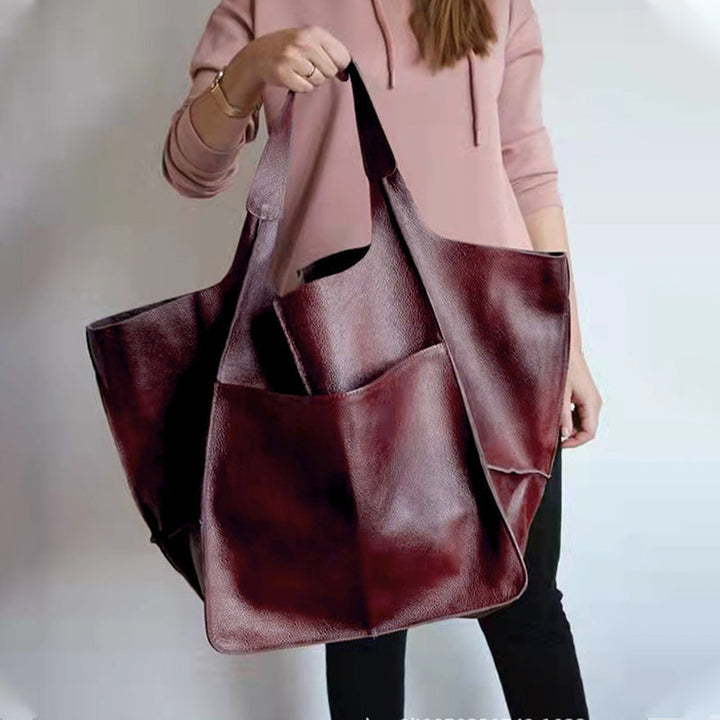 Dame elegant oversize skuldertaske i sort kunstlæder, passer til fest eller hverdag. Elegant tilbehør til damemode.