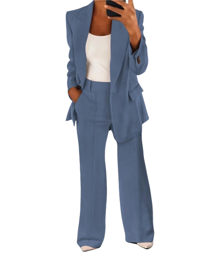 Elegant dame blazer i sort polyester med vide bukser, et stilfuldt og komfortabelt outfit for et moderigtigt look.