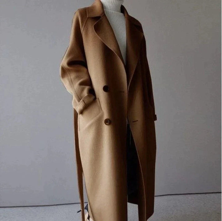 Naisten tyylikäs pitkä musta villakangastakki, klassinen design ja suuret taskut, sopii talven eleganssiin.