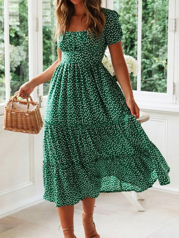 Dame vintage-stil maxi kjole med pufærmer og blomstertryk, firkantet halsudskæring, sommerlig elegance.
