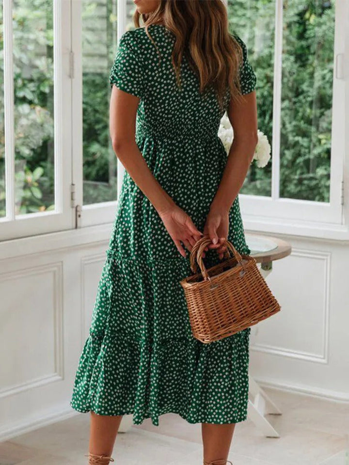 Dame vintage-stil maxi kjole med pufærmer og blomstertryk, firkantet halsudskæring, sommerlig elegance.