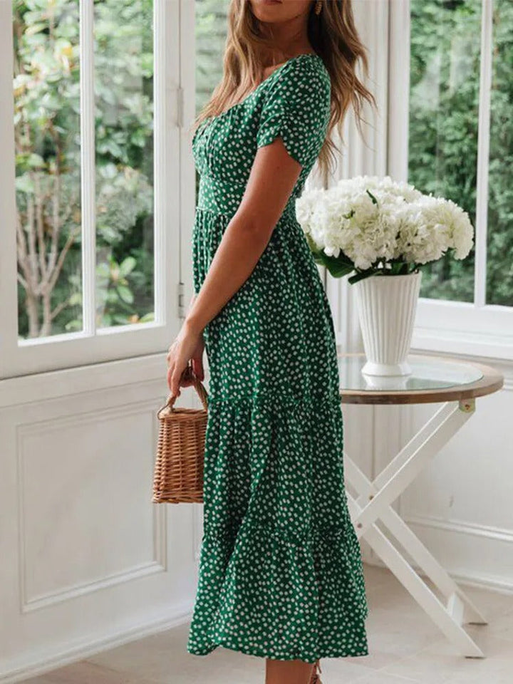 Dame vintage-stil maxi kjole med pufærmer og blomstertryk, firkantet halsudskæring, sommerlig elegance.