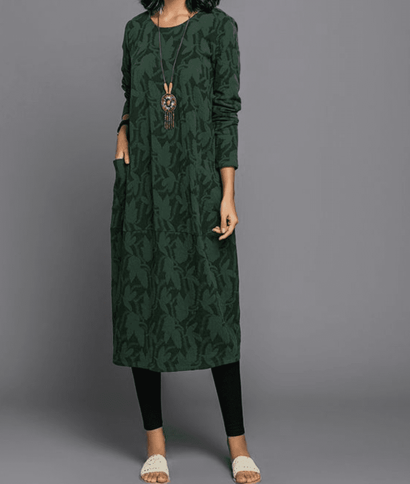Dame vintage-stil kjole i grøn, behagelig og alsidig, med dekorative detaljer set forfra.