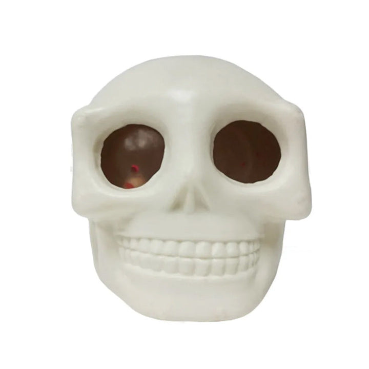 Sjov dødningehoved stressbold til Halloween, grå og hvid, med udstående øjne, perfekt til stresslindring.