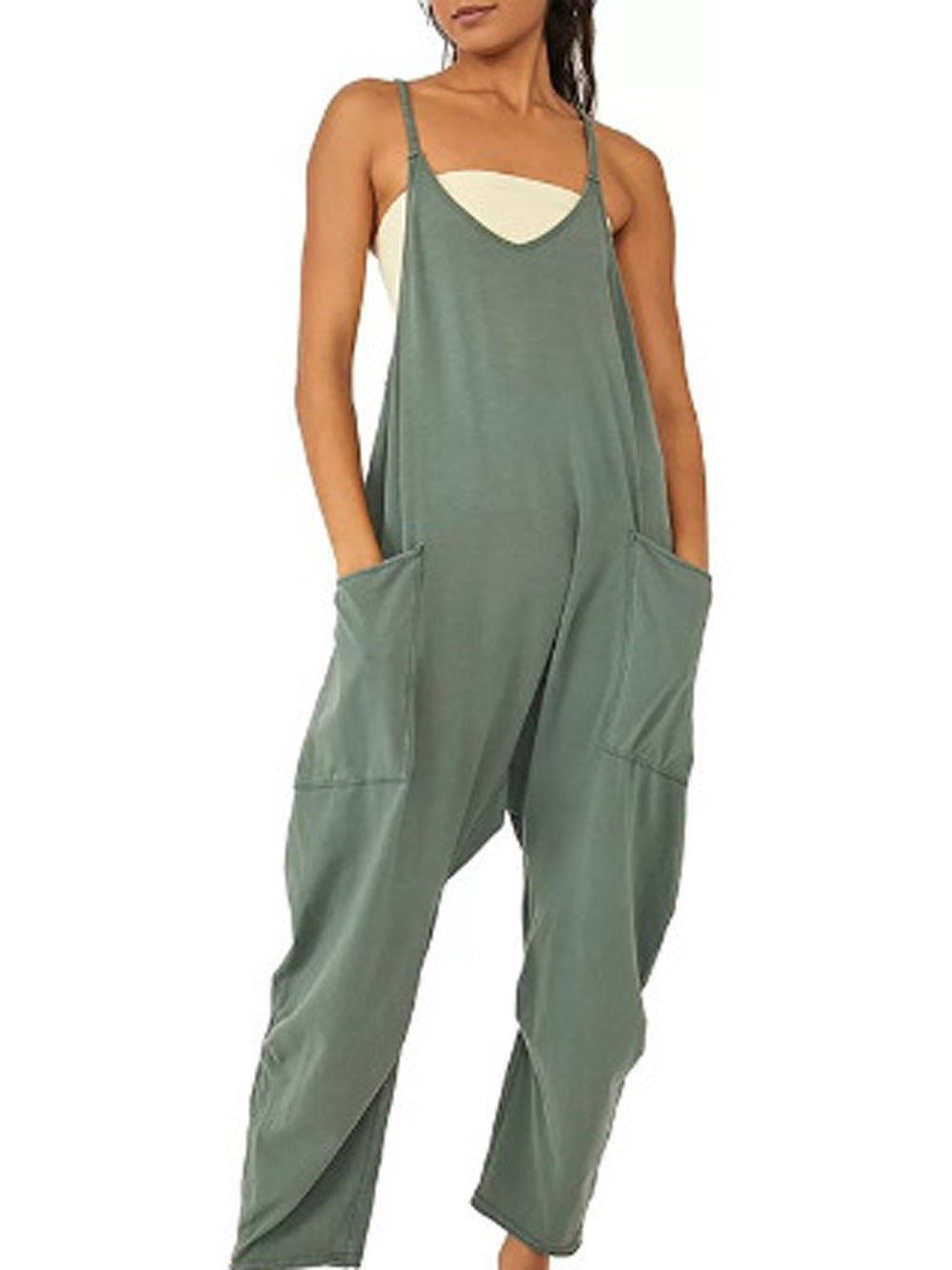 Afslappet dame jumpsuit i let stof, løs og stilfuld, med sidelommer og lynlås bagpå, til behagelige sommerdage.