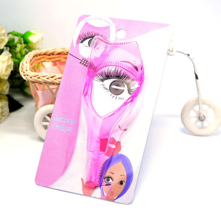 Rosa mascara applikator med buet kam og øjenlågsbeskytter til præcis mascara påføring.