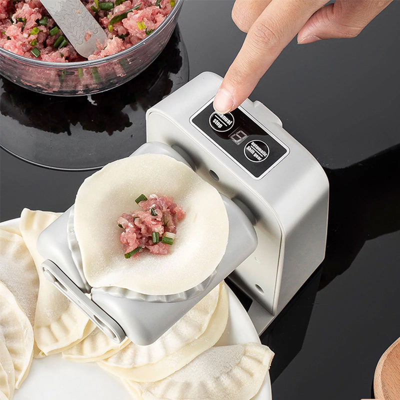 Elektrisk dumplingsmaskine, hvid, innovativ og kompakt design, laver dumplings automatisk og nemt.