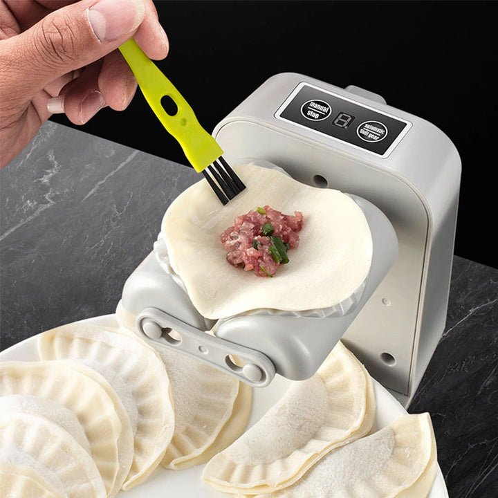 Elektrisk dumplingsmaskine, hvid, innovativ og kompakt design, laver dumplings automatisk og nemt.