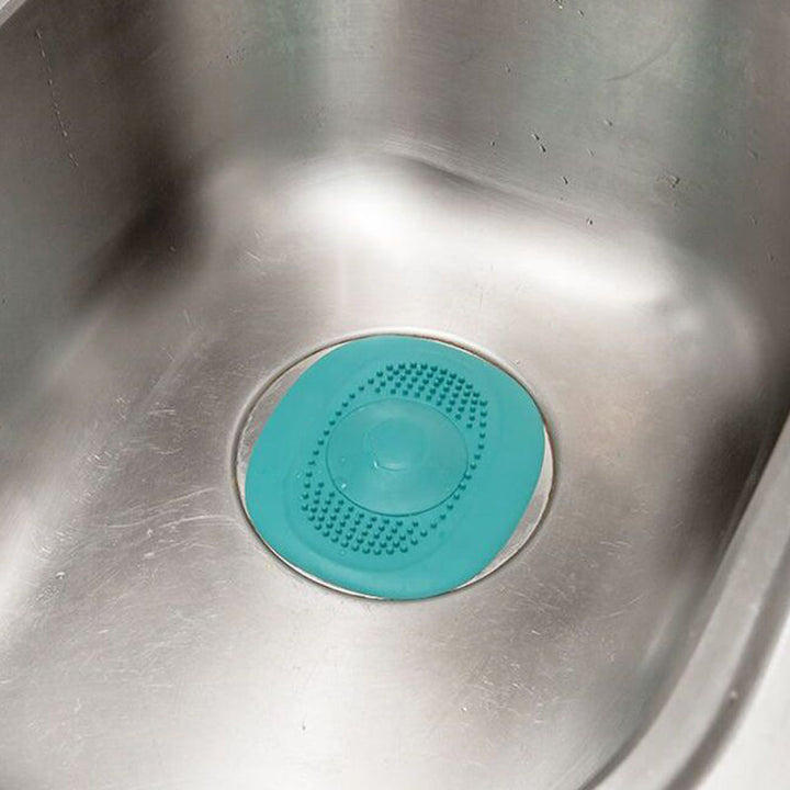 Silikone afløbsprop i fire farver, med enestående fleksibelt design, velegnet til badeværelse eller køkken.