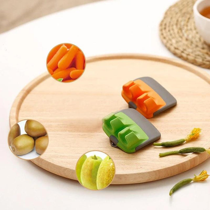 Innovativ skrællekniv med fingerdesign, orange og grøn, ergonomisk og holdbar, nem til skrælning af frugt og grøntsager, 6.5 cm.