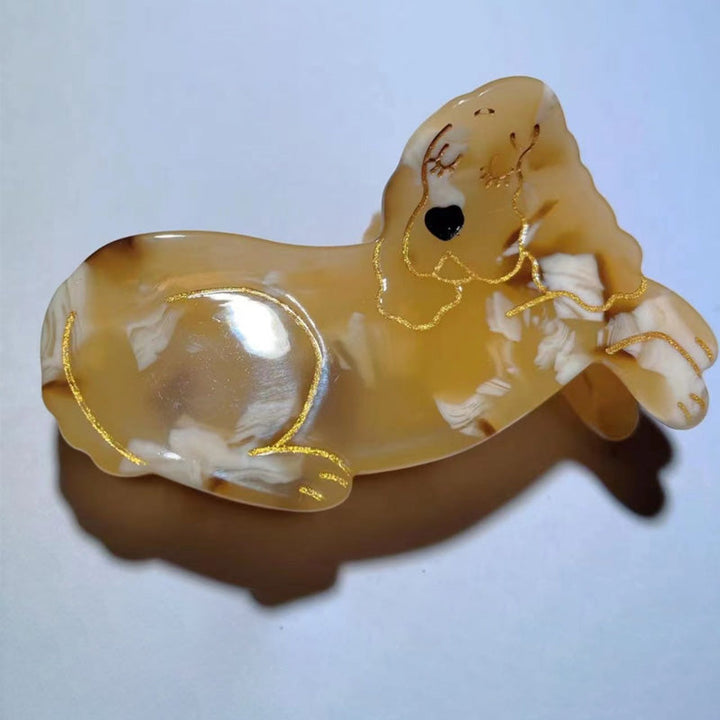 Søde dyreprint hårklemmer i acetat, med hund- og kattefigurer, der tilføjer et legesygt touch.