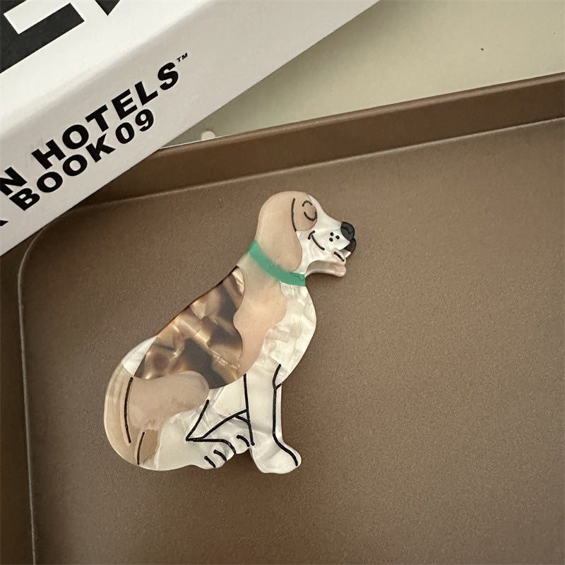 Søde dyreprint hårklemmer i acetat, med hund- og kattefigurer, der tilføjer et legesygt touch.
