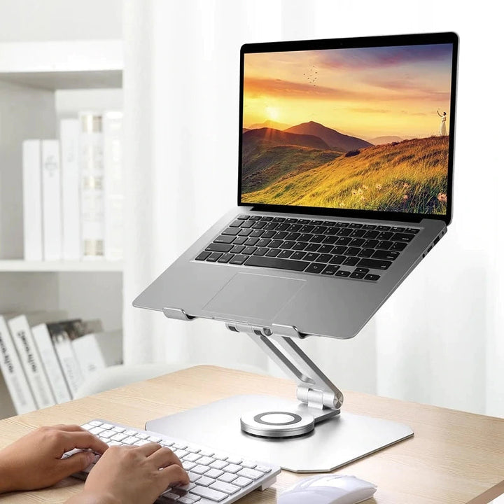 Sammenklappelig og drejelig iPad-holder i aluminium, grå, præsenteret på et bord, 360° justerbarhed, ergonomisk design og holdbar.