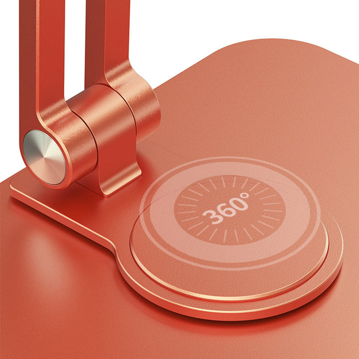 Sammenklappelig og drejelig iPad-holder i aluminium, grå, præsenteret på et bord, 360° justerbarhed, ergonomisk design og holdbar.