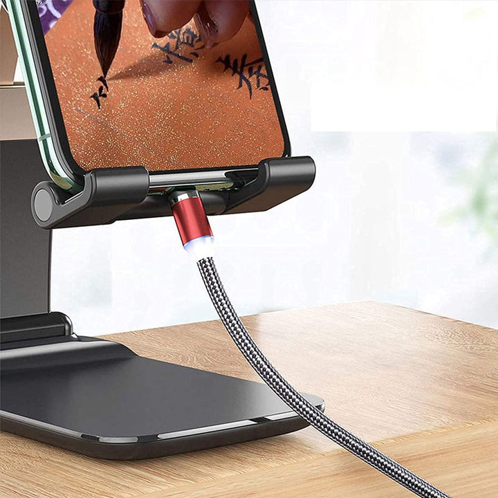 Justerbar og foldbar bordholder til smartphone, sort aluminium, minimalistisk design, velegnet til hjemmet og rejser.