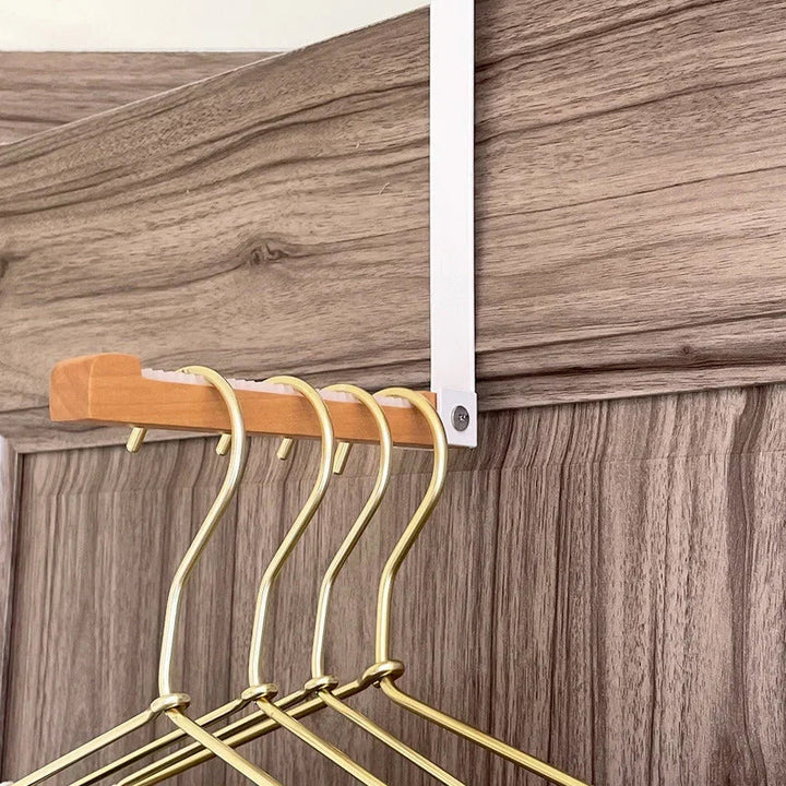 Sammenfoldelige træ dørophæng, sort-hvid, elegant finish, til ophængning og opbevaring.