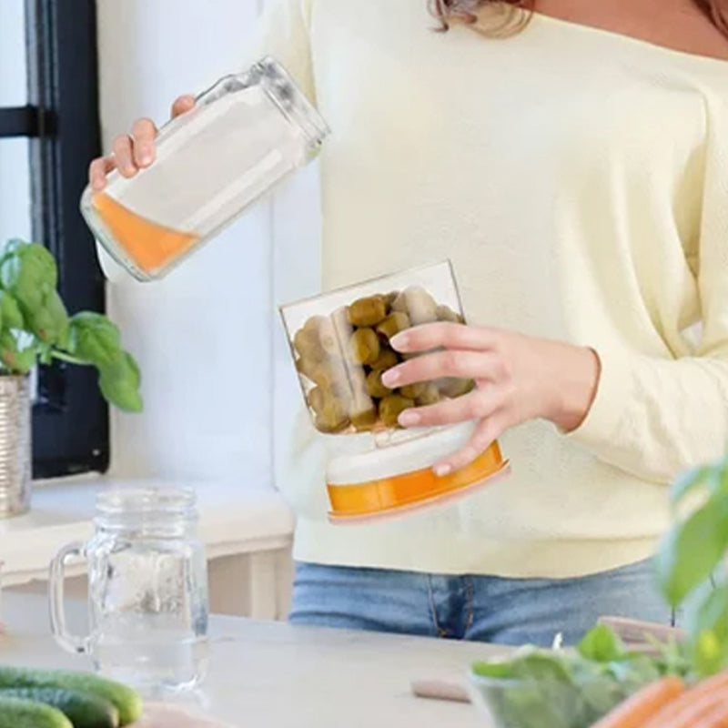 Tæt saltkurk- og olivenbeholder med si, klar plast, låg med grøn forsegling, innovativ køkkenopbevaringsløsning