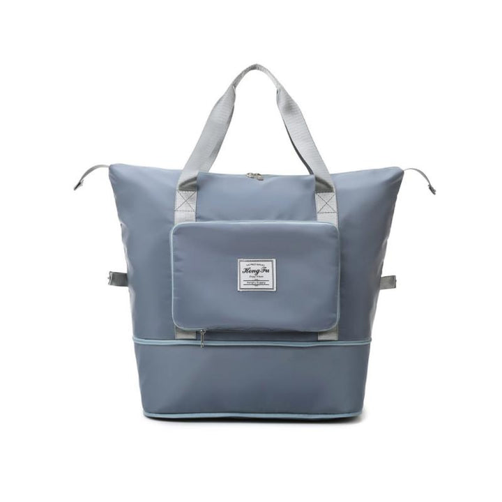 Rum unisex skuldertaske, foldbar og alsidig, lavet af holdbart Oxford-stof, blå, med flere lommer, skulderrem og håndtag