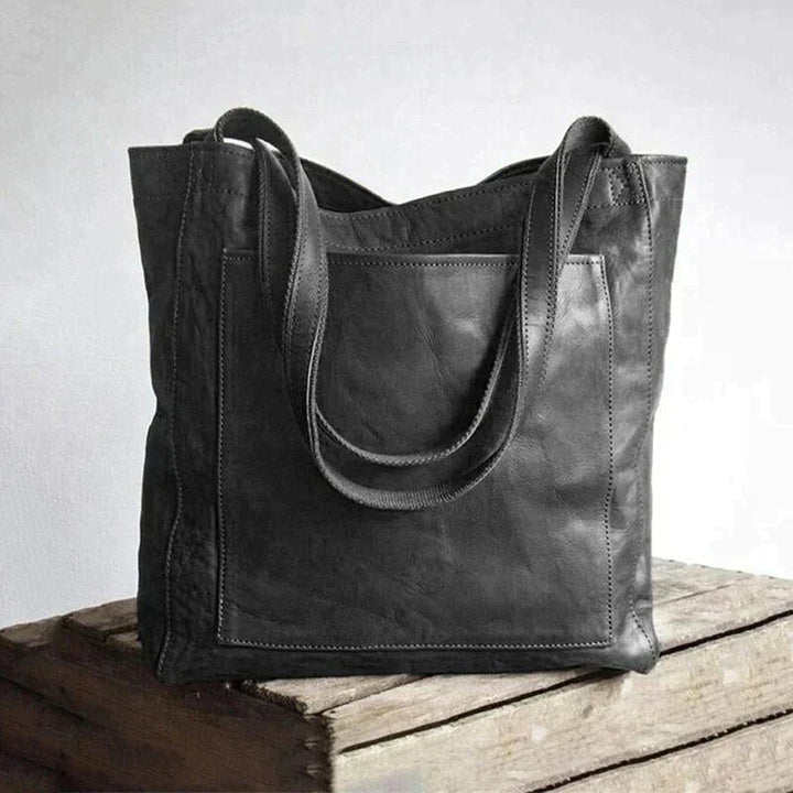 Stilfuld og rummelig dame vegansk håndtaske, moderne design, lavet af miljøvenligt PU-læder.