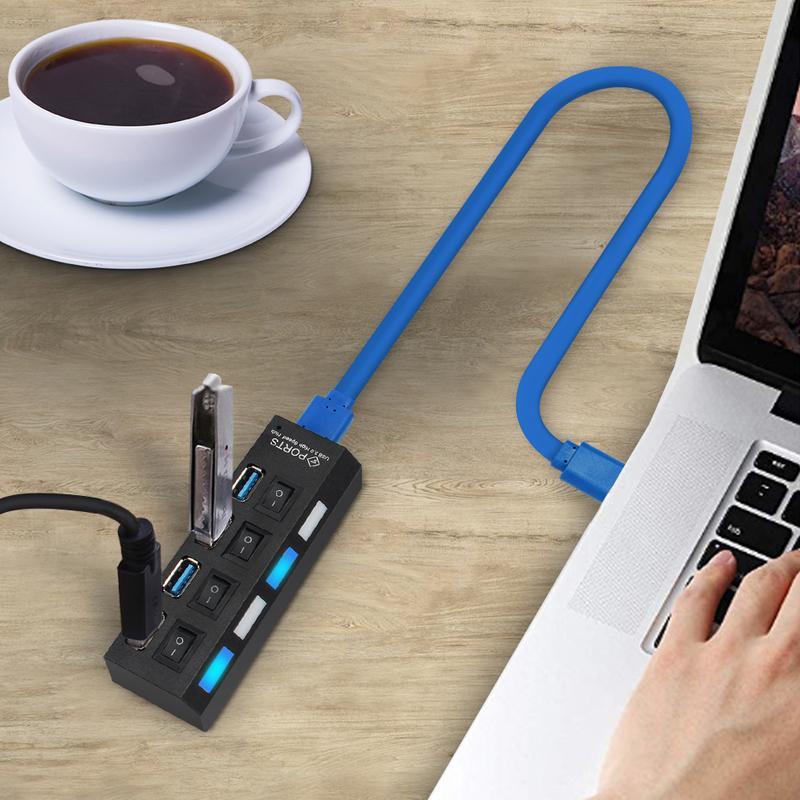Stilfuld sort USB-hub med 7 porte, højhastighed, individuelt oplyste kontakter, moderne og effektiv.