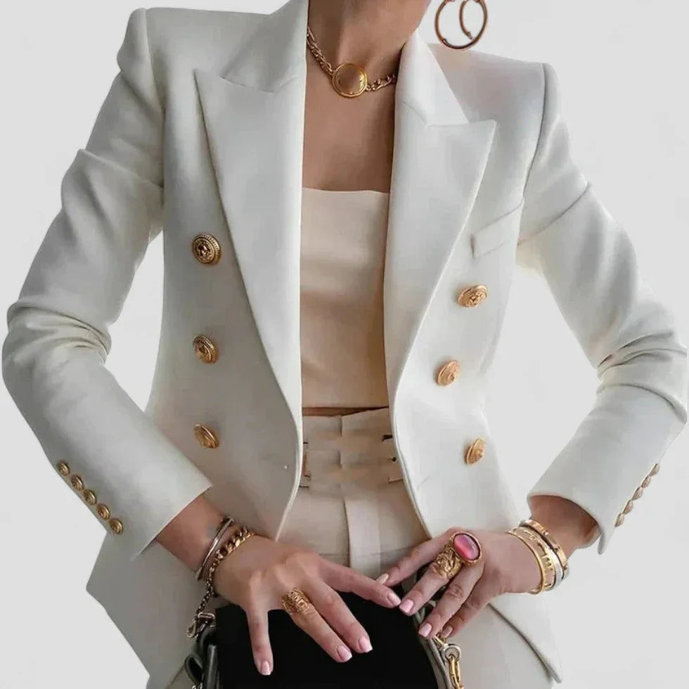 Elegant dame dobbeltspændt blazer med guldfarvede knapper, skræddersyet pasform og strukturerede skuldre.
